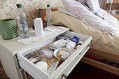 Medicine in nightstand drawer and bedside