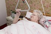Old woman lying in sickbed