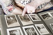 Old woman looking into photo album, close-up