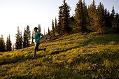 A woman on an early morning run on the Wasatch Crest trail.