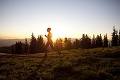 A woman on an early morning run on the Wasatch Crest trail.