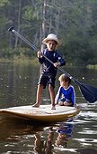 Six-year-old and four-year-old brothers on a SUP