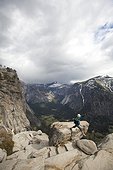 Young woman hiking the Yosemite Falls trail. Yosemite National Park, CA