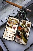 A box of fly fishing lures while fly fishing on the Bow River in Calgary, Alberta, Canada.