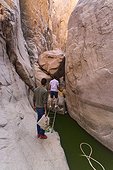 Rear view of people enjoying adventure at Weshwash Valley, South of Sinai, Egypt