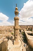 View of minaret of Zuwayla Door against cloudscape, Cairo, Egypt