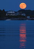The full Buck Moon, also known as the Thunder Moon, rises over Basket Island off of Hills Beach in Biddeford, Maine, USA on Sunday, July 9, 2017.