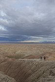 Adult couple hiking in badlands section of Anza Borrego State Park, California, USA
