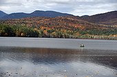 Fall foliage reflected in Chocorua Lake in Tamworth, New Hampshire, USA