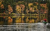 Fall foliage reflected in Chocorua Lake in Tamworth, New Hampshire, USA