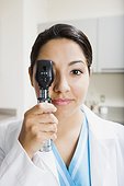 Doctor using ophthalmoscopes