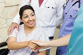 Patient shaking hand of nurse