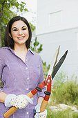 Woman holding gardening shears