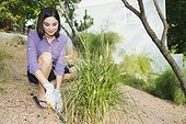 Woman digging in her garden