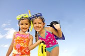 sisters with snorkel gear at beach