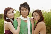 young man and two young women at Saigon River