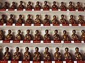 Rows of miniature Buddha statues. China,Hong Kong,Sha Tin,10,000 Buddha Monastery