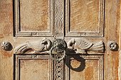 ornate door of church in Ancient Agora. ornately carved door with two birds, the entrance to a small church in Ancient Agora