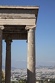 columns of the Erechtheion temple at the Acropolis. columns of the Erechtheion temple at the Acropolis with the city and mountains beyond