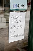 SIGN IN SHOP SAYING CLOSED EARLY. SIGN IN SHOP TO SIGNIFY CLOSING EARLY DUE TO SNOWY/WINTRY WEATHER
