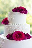 Wedding cake decorated with roses.