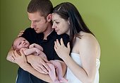 Couple holding newborn son