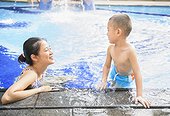 Mother and kid relaxed in swimming pool