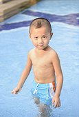 Kid standing in the swimming pool