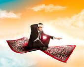 Business man flies on magic carpet