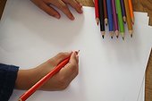Small child using coloring pencils