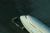 Jumbo Jet being towed shot from above