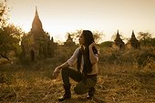 Beautiful woman exploring ancient temples at Bagan in Myanmar.