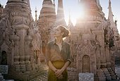 Beautiful woman visiting the ancient Buddhist site of Kakku Pagodas in Myanmar.