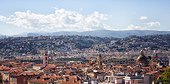 Nice, France, French Riviera, old town, with mountains in background and French flag flying