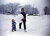 Father and son playing in the snow