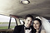 Newlyweds in a car