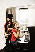 Children practicing on saxophone and piano