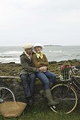 Couple with bicycles embracing