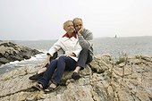 Couple sitting on rocks