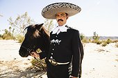Man in sombrero with horse
