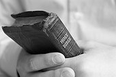 Young man holding bible