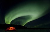 Illuminated expedition tent and traditional wooden snow shoes, Northern Lights, Polar Lights, Aurora Borealis, green, near Whitehorse, Yukon Territory, Canada