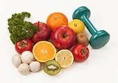 Fruit and vegetables with a dumbbell