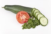 Cucumber with cucumber slices, tomato and parsley