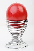 Red Easter egg in an eggcup