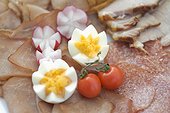 Easter snacks, snack plate with ham, sausage, vegetables and egg