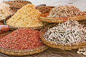 Dried fish and shrimps in bamboo bowls, market, China, Asia