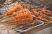 Shrimps and grasshoppers on a skewer, Chinese snack