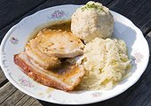 Roast pork with bread dumplings and sauerkraut