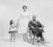 Man in wheelchair with girl holding nurse hand on white background